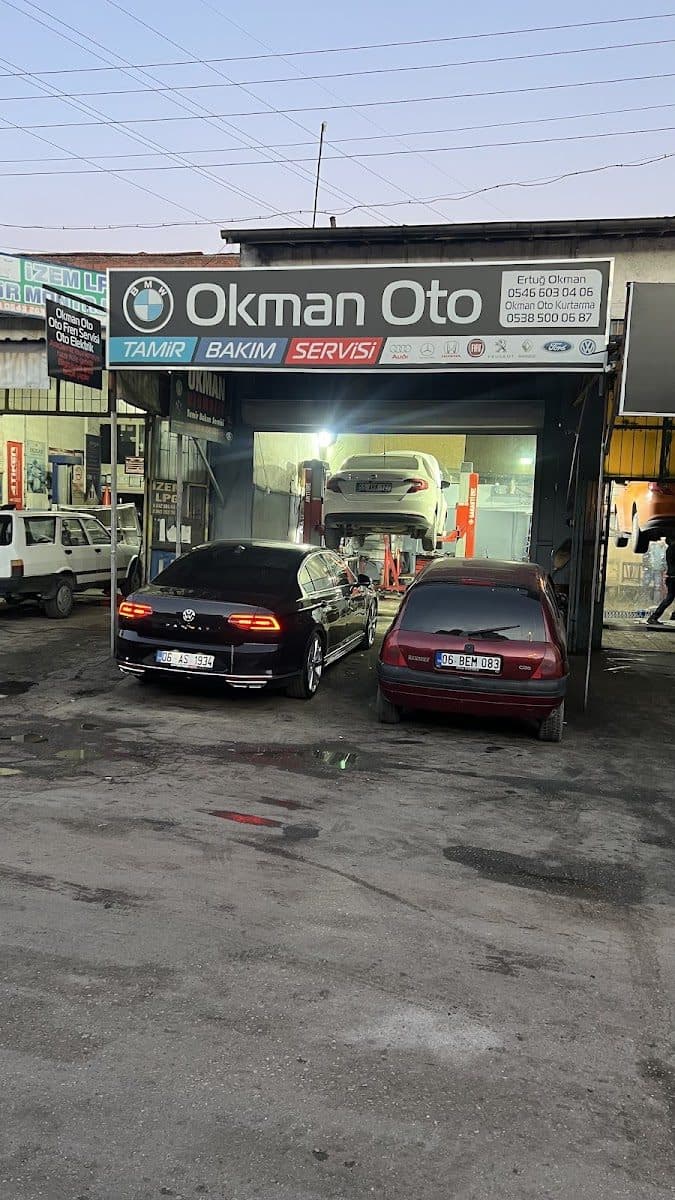 Okman Oto dükkân görünümü ve tabelası