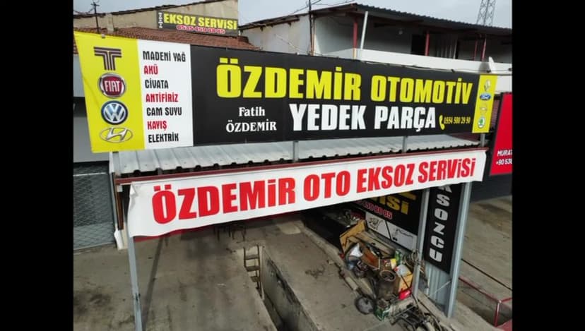 Özdemir Oto Egzoz Servisi tabelası