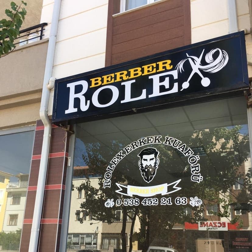 Rolex Erkek Kuaförü — dükkân vitrini ve logosu