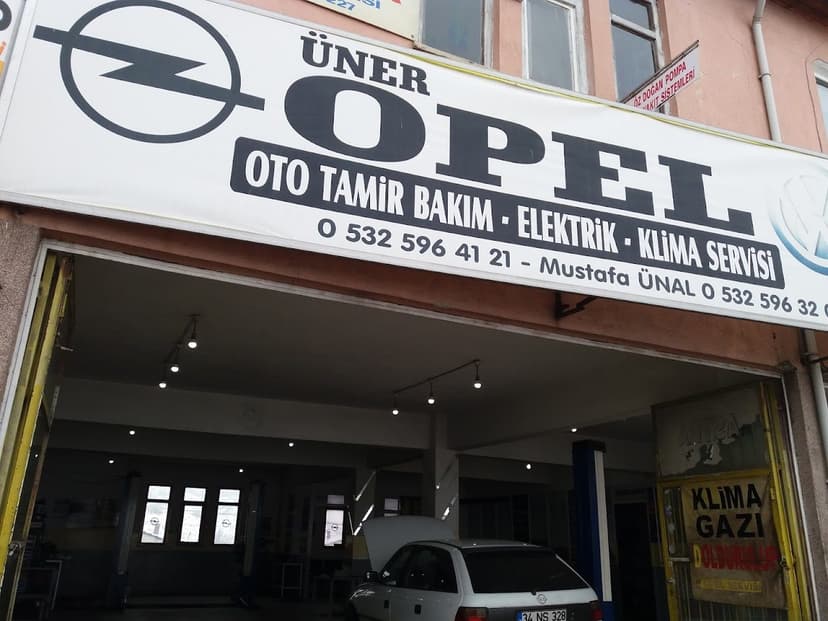 Üner Opel Özel Servisi dükkân tabelası ve servis alanı