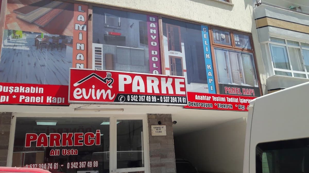 Evim Parke dükkân görünümü — laminant, çelik kapı ve panel kapı tabelası